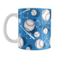 Blue Baseball Pattern Mug (11oz) at Amy's Coffee Mugs. A ceramic coffee mug designed with a pattern of baseballs, baseball diamonds, baseball bats, and dark blue circles over a blue background color that wraps around the mug up to the handle.