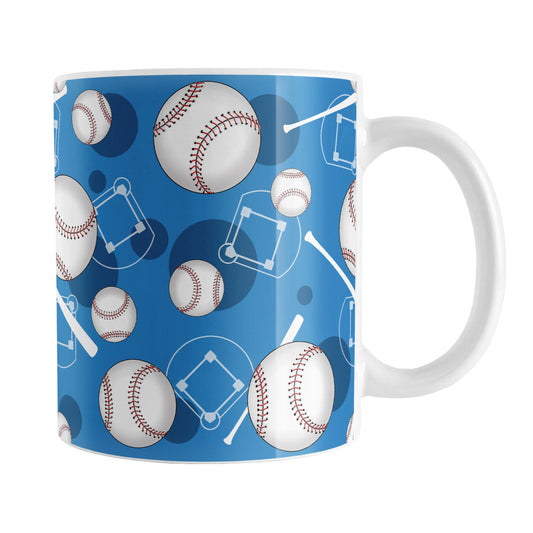 Blue Baseball Pattern Mug (11oz) at Amy's Coffee Mugs. A ceramic coffee mug designed with a pattern of baseballs, baseball diamonds, baseball bats, and dark blue circles over a blue background color that wraps around the mug up to the handle.