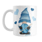 Blue Crochet Gnome Mug (11oz) at Amy's Coffee Mugs. A ceramic coffee mug designed with a cute gnome wearing a blue crochet hat while holding a ball of blue yarn and a crochet hook with blue hearts around him. This adorable gnome is on both sides of the mug. 