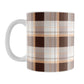 11 oz brown orange plaid mug with dark brown, light brown, white, and warm orange layered plaid pattern.