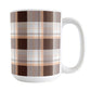 15 oz brown orange plaid mug with dark brown, light brown, white, and warm orange layered plaid pattern.