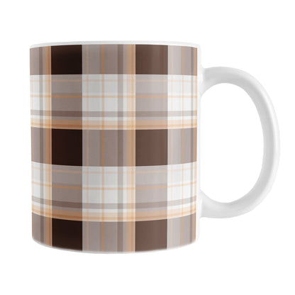 11 oz brown orange plaid mug with dark brown, light brown, white, and warm orange layered plaid pattern.