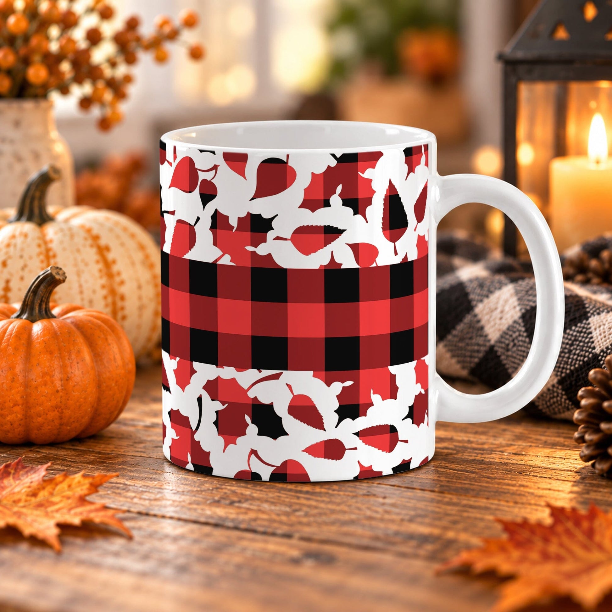 11 oz red and black buffalo plaid fall mug with assorted autumn leaf shapes and a wide checkered band around the center.