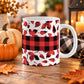 11 oz red and black buffalo plaid fall mug with assorted autumn leaf shapes and a wide checkered band around the center.