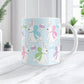 11oz mug with Easter-themed design featuring bunnies and eggs on a light blue background, on a marble countertop