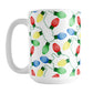 White mug with colorful Christmas light bulb pattern on a white background