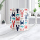 Coastal Crustaceans Mug (11oz) at Amy's Coffee Mugs. A ceramic coffee mug with crabs, lobsters, and shrimp, in colors of ocean navy, coral red, sand beige, and teal, in a pattern that wraps around the mug up to the handle. Image shows the mug on a white marble countertop.