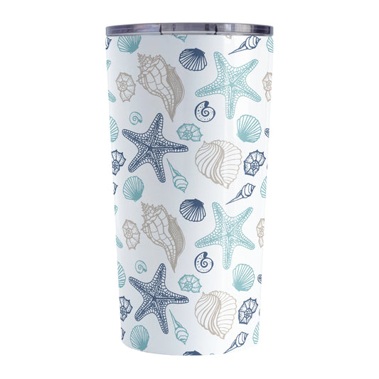 Coastal Seashells Pattern Tumbler Cup (20oz) at Amy's Coffee Mugs. A stainless steel tumbler cup with a summer beach-inspired pattern of seashells in navy blue, teal, and sandy beige over white that wraps around the cup.