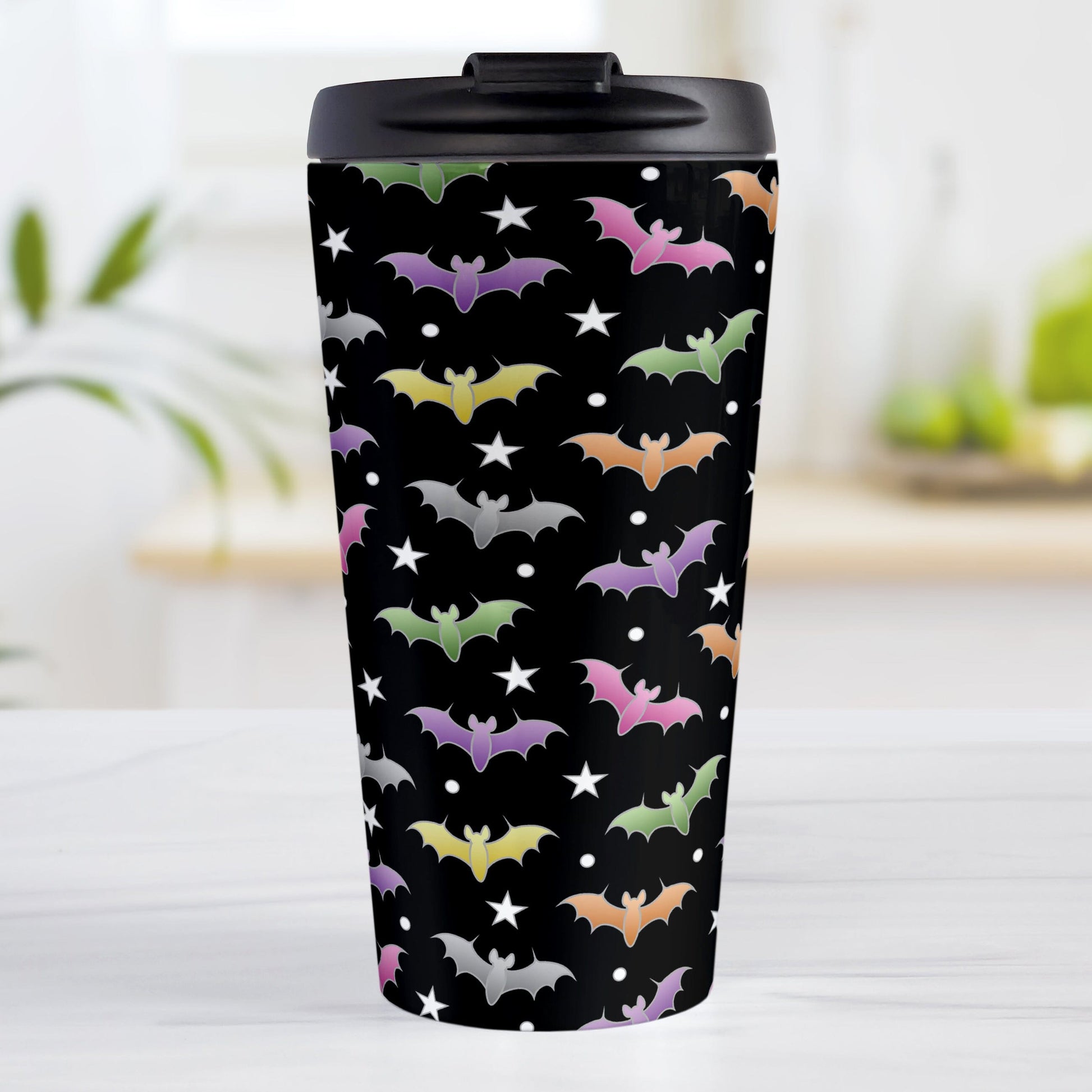 Colorful Bats Travel Mug at Amy's Coffee Mugs. A 15oz travel mug designed with different colored bats and white stars in an assorted pattern over a black background color that wraps around the mug.