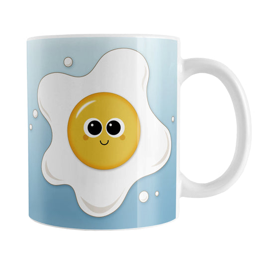 Cute Fried Egg Blue Breakfast Mug (11oz) at Amy's Coffee Mugs. A ceramic coffee mug designed with a cute and happy fried egg on both sides of the mug over a gradient blue background color that wraps around the mug up to the handle.