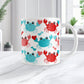 11oz white mug with a red and turquoise crabs pattern design, on a marble countertop