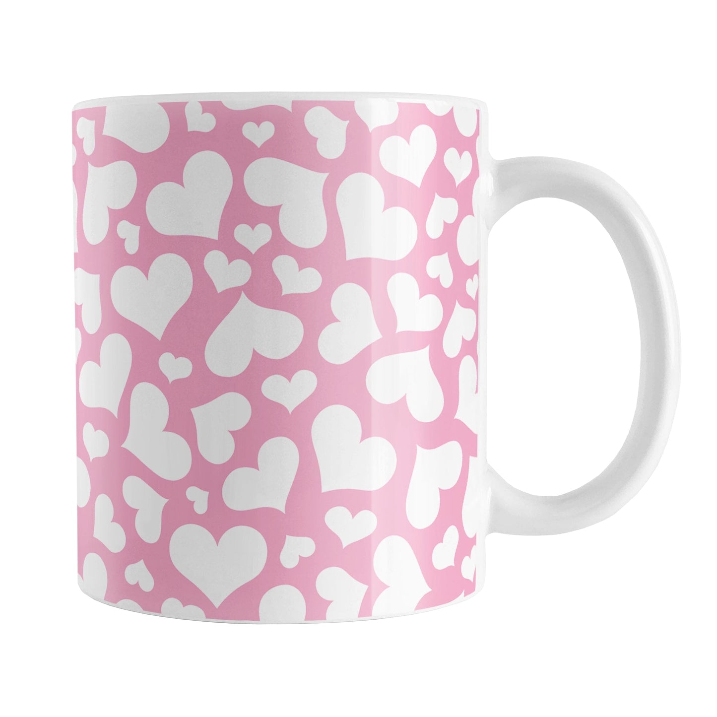 Cute White Hearts on Pink Mug (11oz) at Amy's Coffee Mugs. A ceramic coffee mug designed with a multi-directional pattern of cute white hearts over a pink background color that wraps around the mug to the handle.