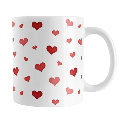 Dainty Cute Red Hearts Mug (11oz) at Amy's Coffee Mugs. A ceramic coffee mug designed with a print of cute and dainty hand-drawn re hearts in different shades of red in a pattern that wraps around the mug up to the handle. 