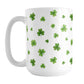 Dainty Shamrocks and Clovers Mug (15oz) at Amy's Coffee Mugs. A ceramic coffee mug designed with hand-drawn green shamrocks and 4-leaf clovers in a dainty minimalist pattern that wraps around the mug up to the handle.