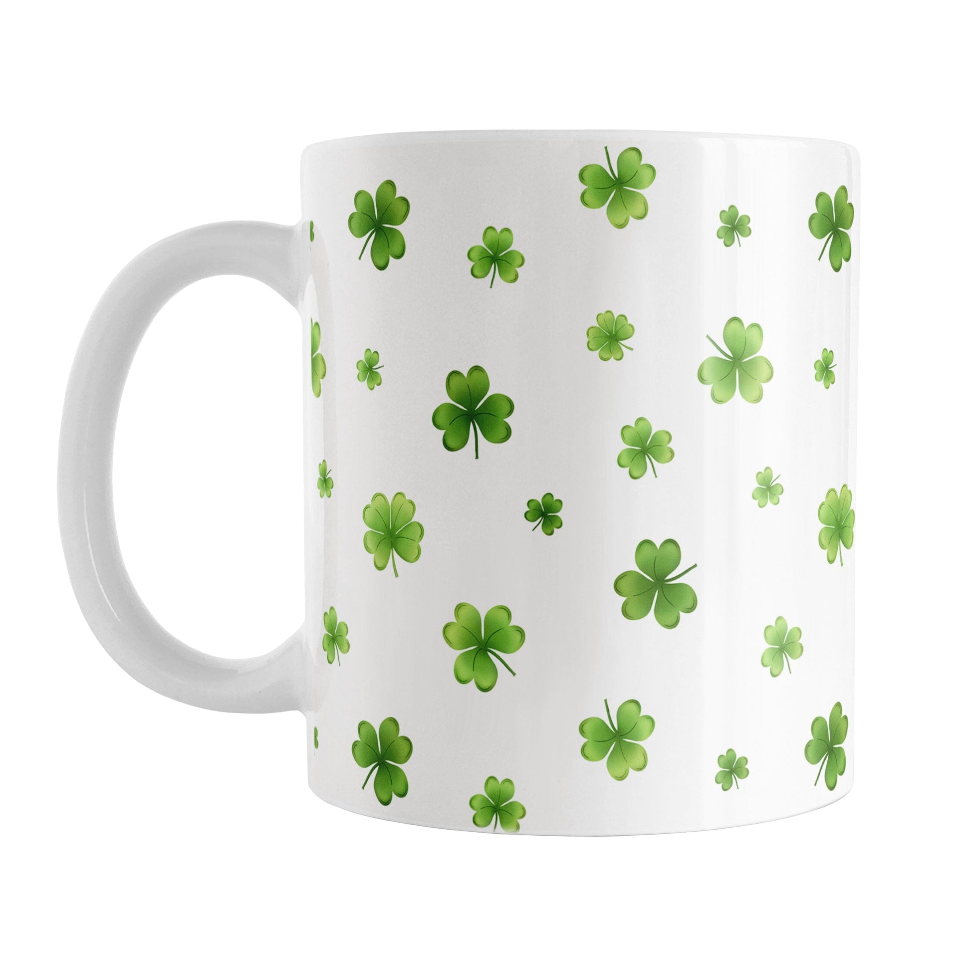 Dainty Shamrocks and Clovers Mug (11oz) at Amy's Coffee Mugs. A ceramic coffee mug designed with hand-drawn green shamrocks and 4-leaf clovers in a dainty minimalist pattern that wraps around the mug up to the handle.