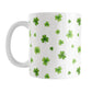 Dainty Shamrocks and Clovers Mug (11oz) at Amy's Coffee Mugs. A ceramic coffee mug designed with hand-drawn green shamrocks and 4-leaf clovers in a dainty minimalist pattern that wraps around the mug up to the handle.