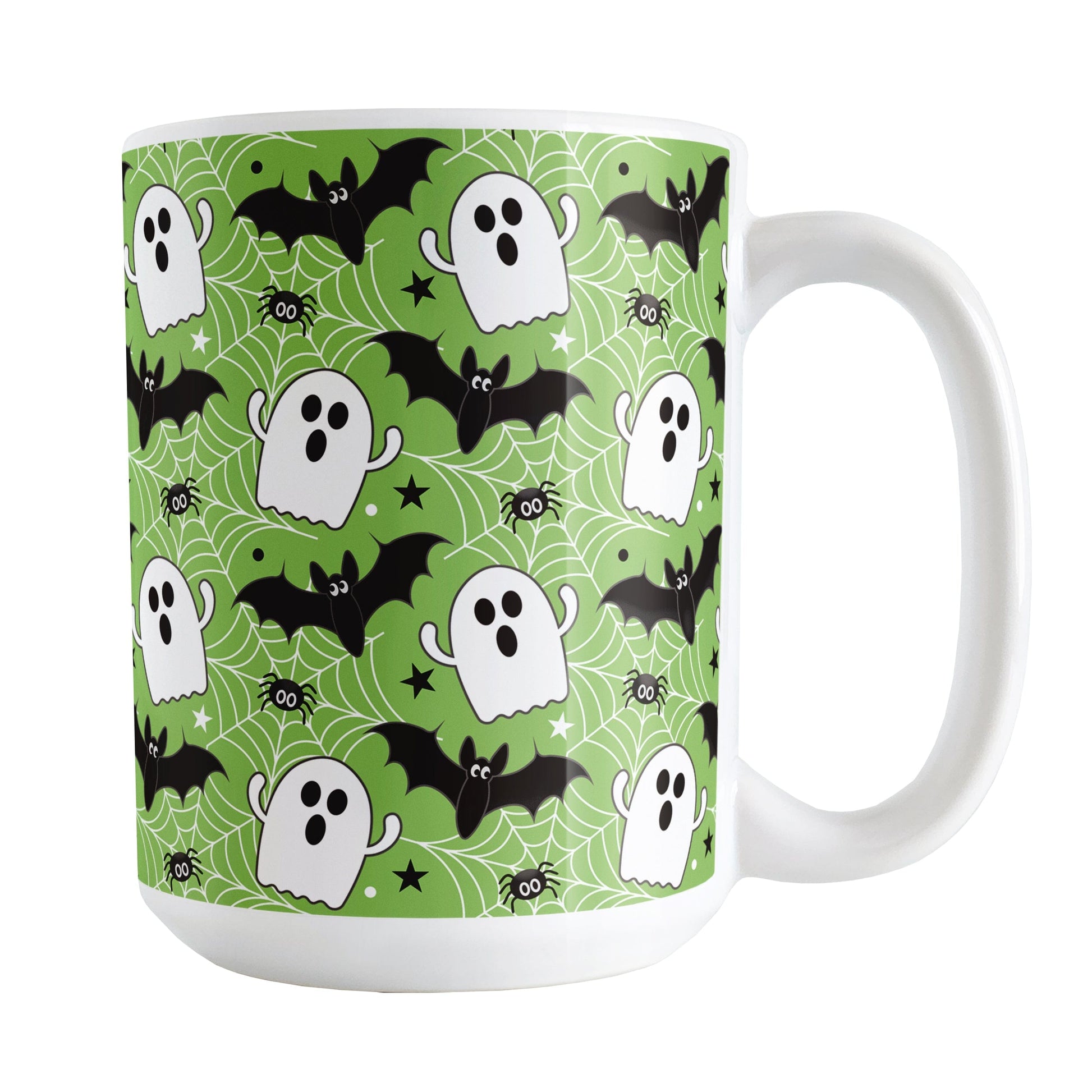 Halloween-themed mug with ghosts, bats, and spiders on a green background