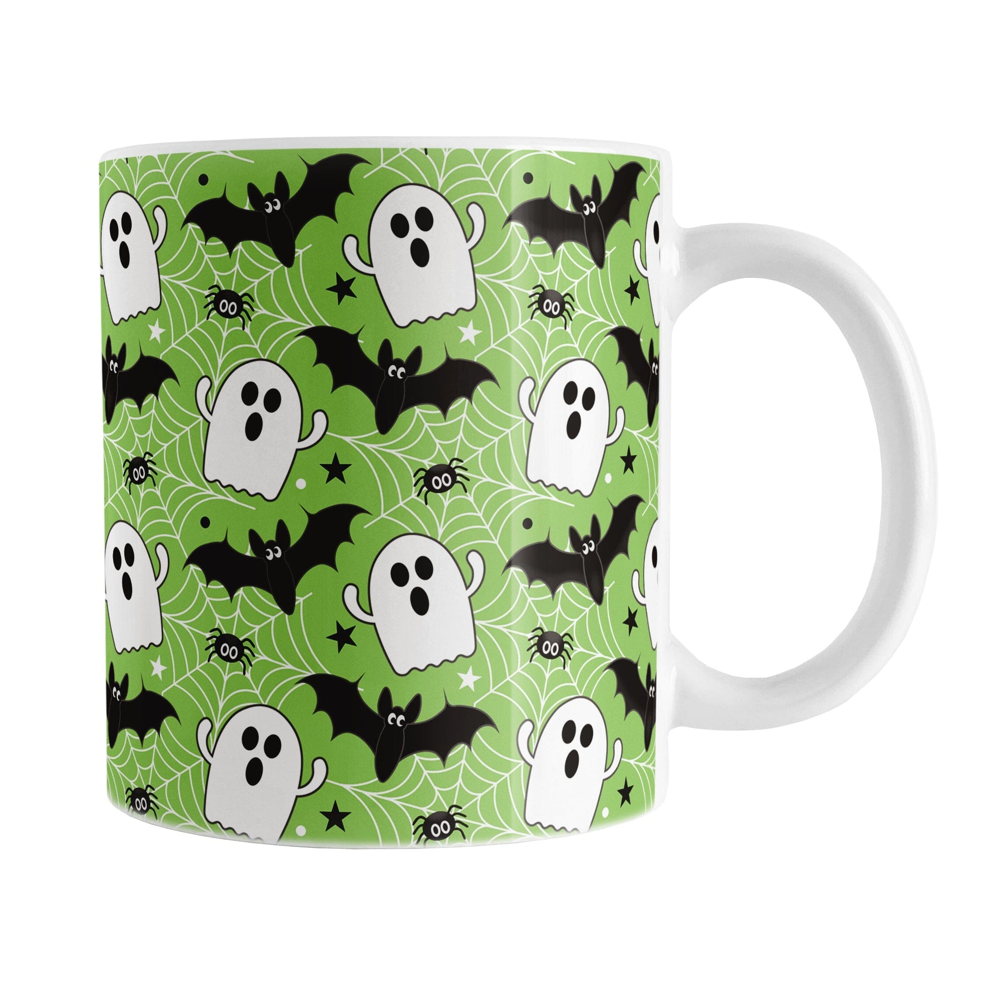 Halloween-themed mug with ghost, bat, and spider pattern on a green background