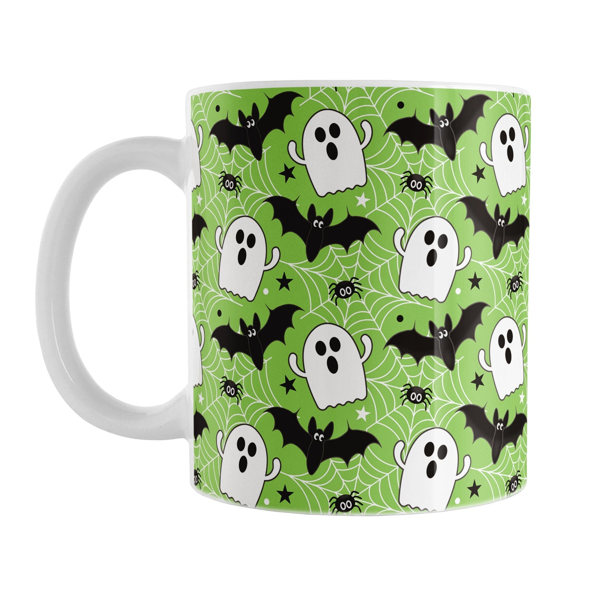 Mug with Halloween-themed design featuring ghosts, bats, and spiders on a green background.