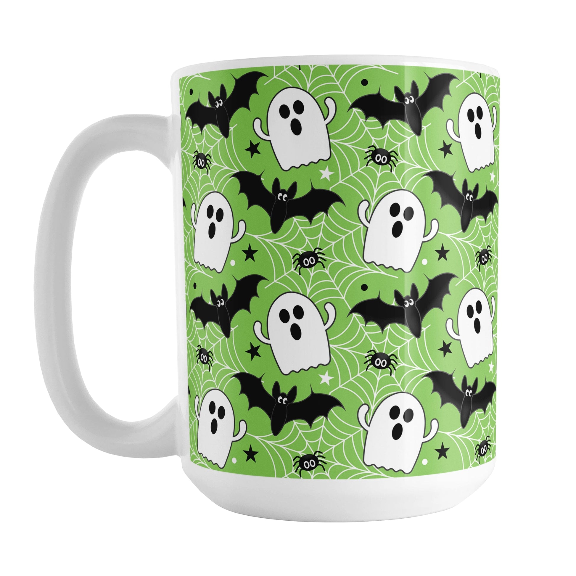 Mug with Halloween-themed design featuring ghosts, bats, and spiders on a green background.