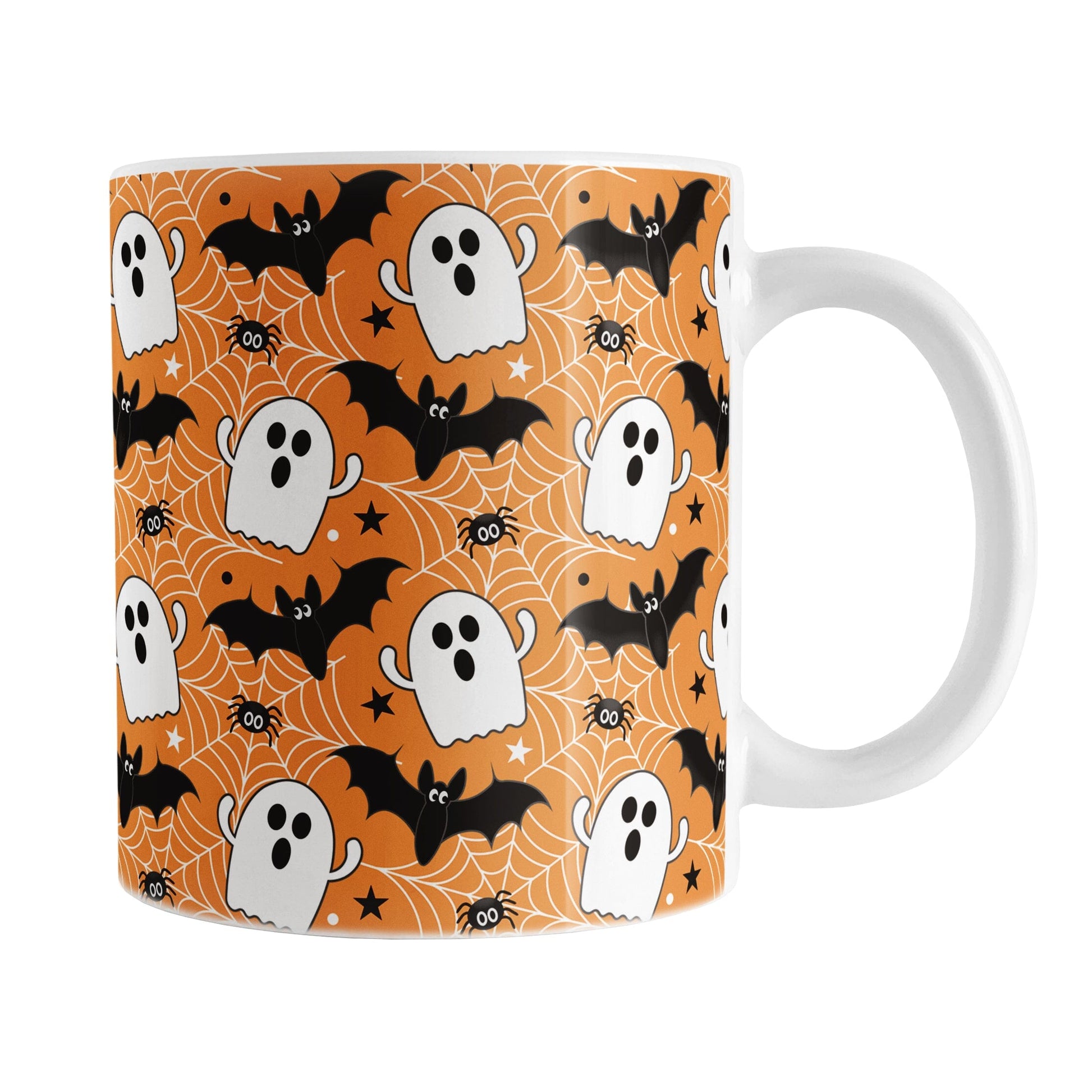Halloween-themed mug with ghost, bat, and spider design on an orange background