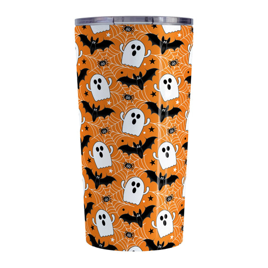 Tumbler with Halloween-themed design featuring ghosts, bats, and spider webs on an orange background.