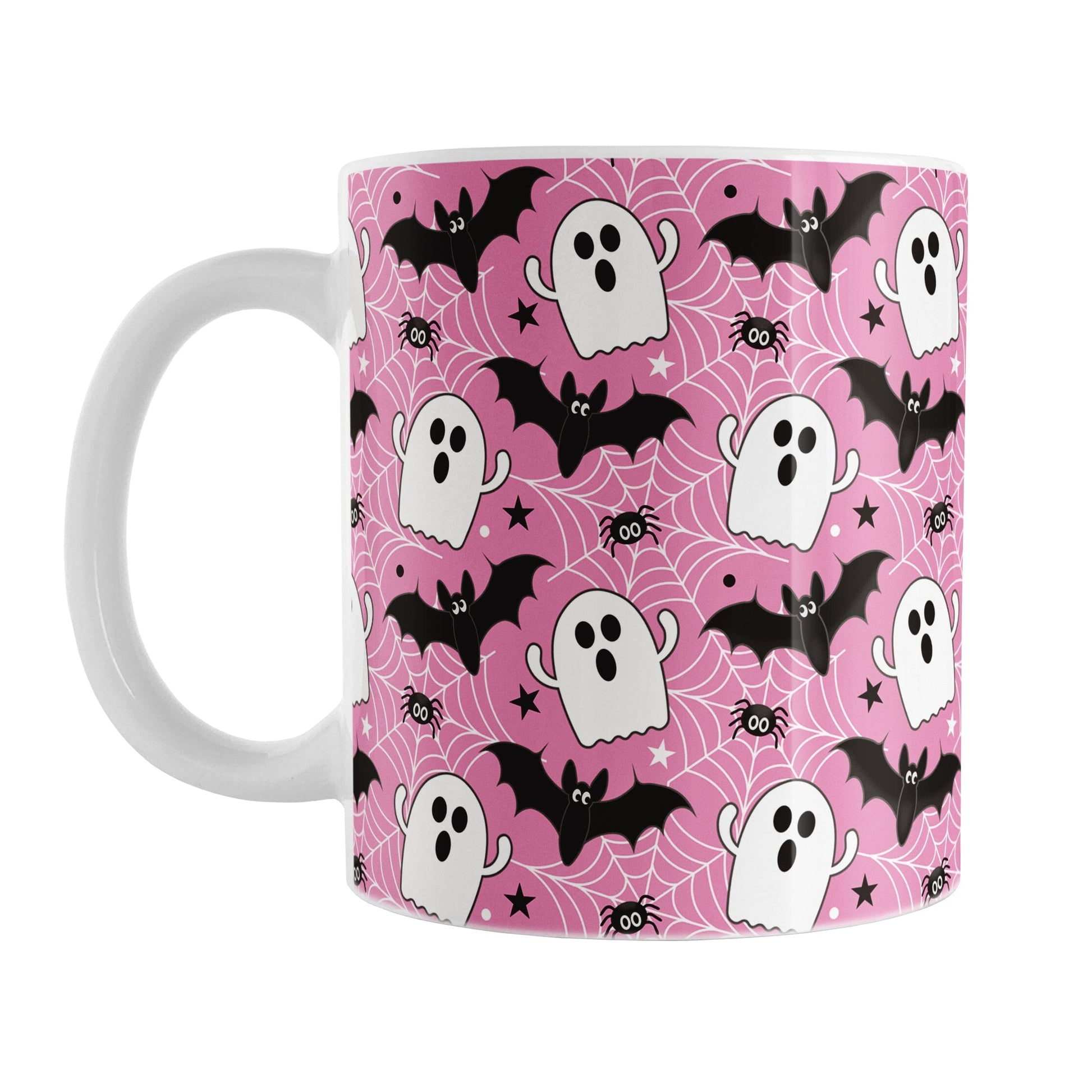 Pink mug with Halloween-themed design featuring ghosts, bats, and spider webs
