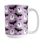 Mug with Halloween-themed design featuring ghosts, bats, and spiders on a purple background.