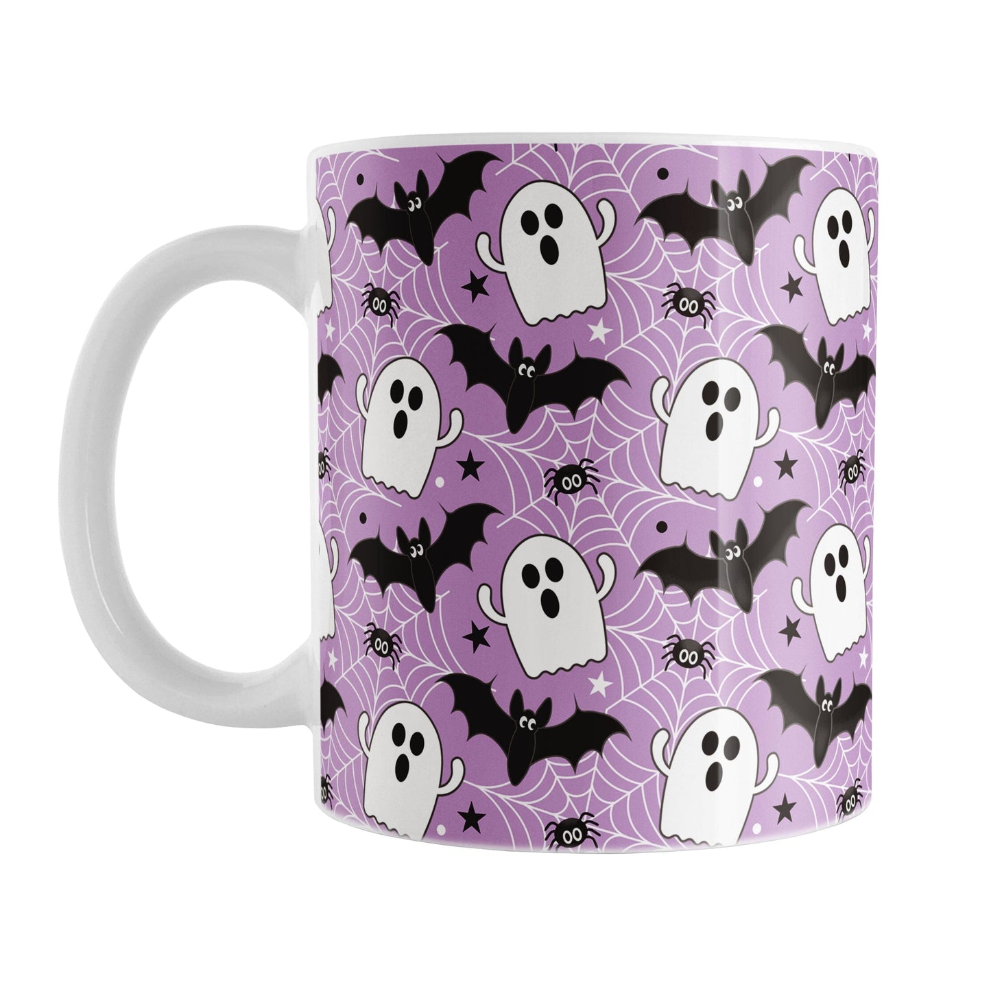Mug with Halloween-themed design featuring ghosts, bats, and spider webs on a purple background.