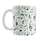 Green Music Notes Pattern Mug (11oz) at Amy's Coffee Mugs. A ceramic coffee mug designed with music notes and symbols in green, black, and gray in a pattern that wraps around the mug to the handle.