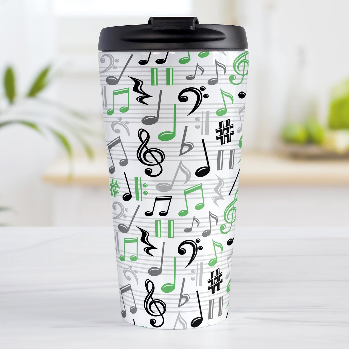 Green Music Notes Pattern Travel Mug (15oz) at Amy's Coffee Mugs. A stainless steel travel mug designed with music notes and symbols in green, black, and gray in a pattern that wraps around the travel mug.