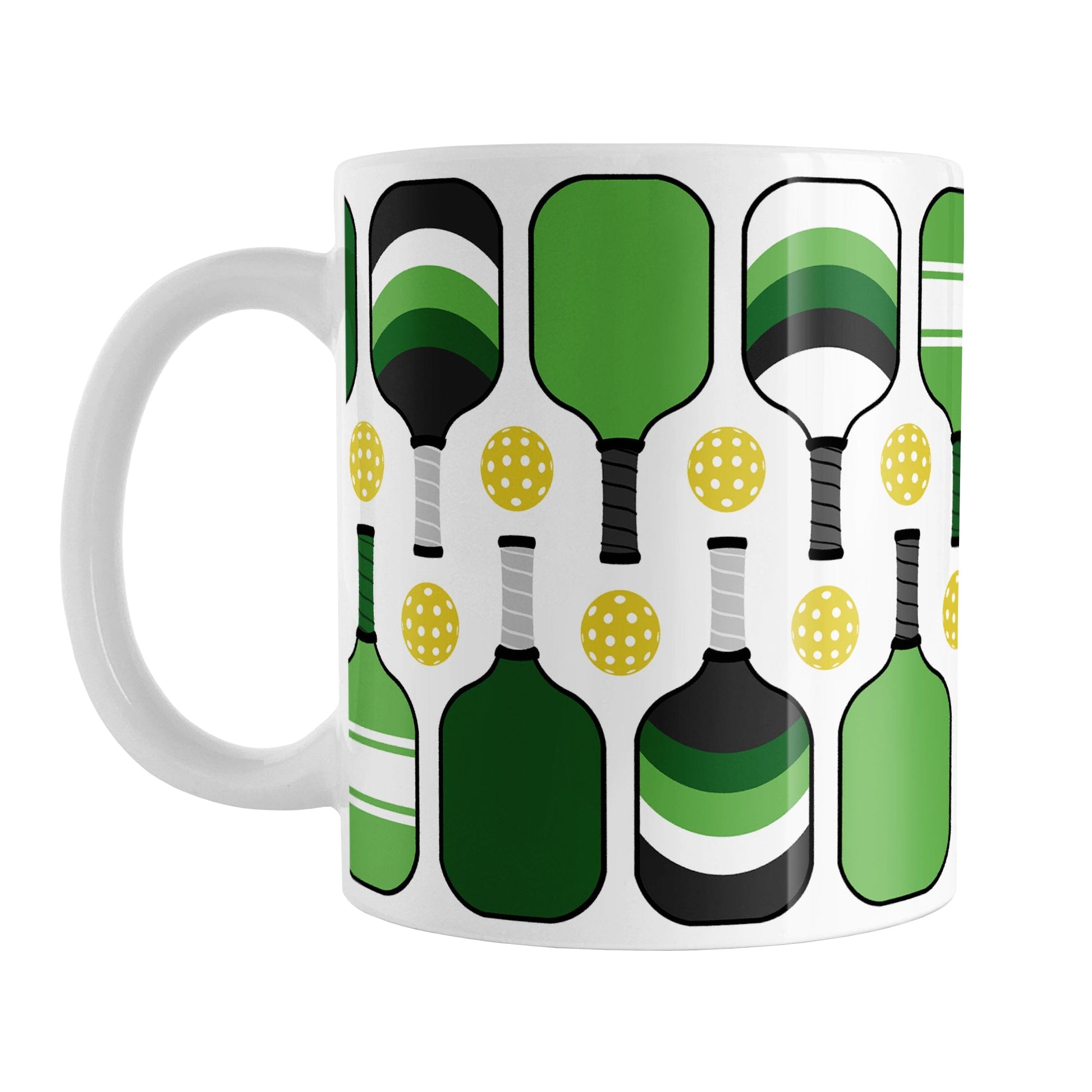 Green Pickleball Mug (11oz) at Amy's Coffee Mugs. A ceramic coffee mug designed with modern green pickleball paddles and yellow balls in a pattern that wraps around the mug up to the handle.