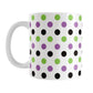 White mug with colorful polka dot pattern in green, purple, and black, on a white background