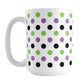 White mug with colorful polka dot pattern in green, purple, and black, on a white background