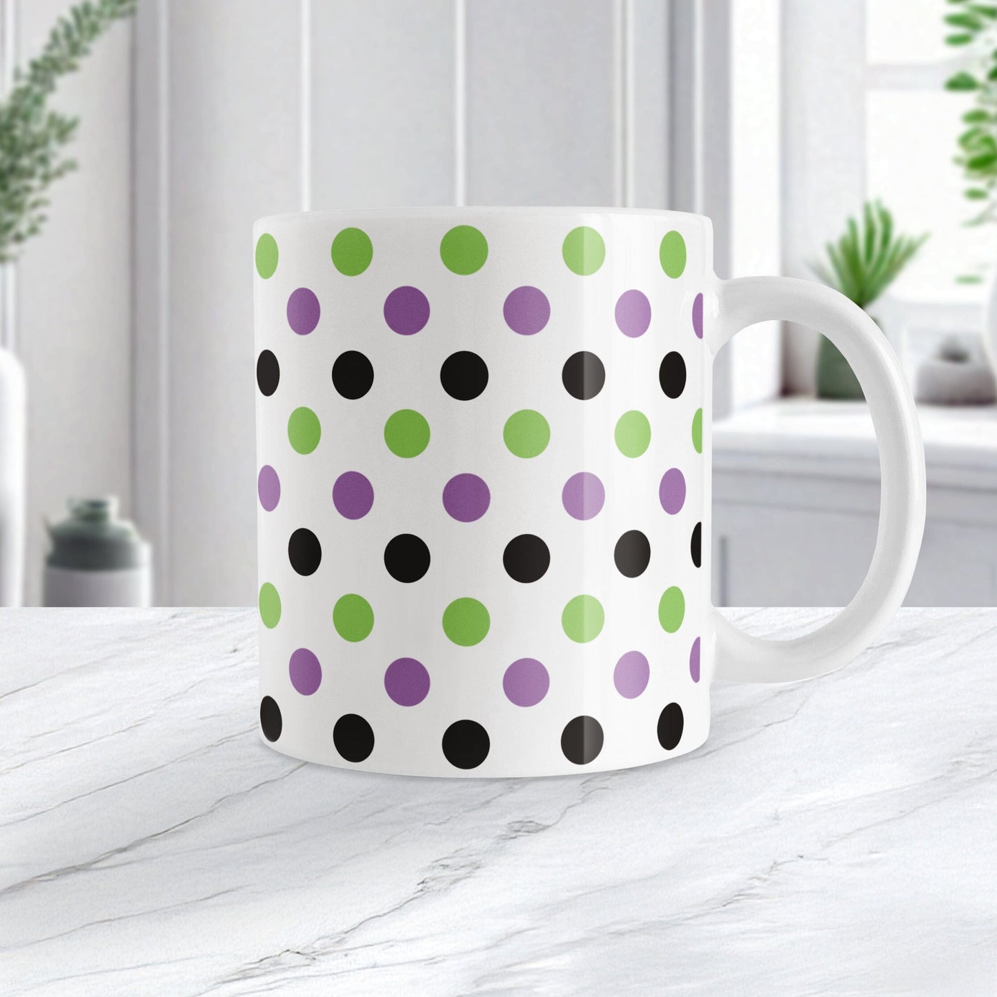 White mug with green, black, and purple polka dots on a white surface.