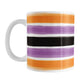 Mug with horizontal paint brush stroke stripes in orange, purple, black on white  for Halloween