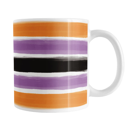 Mug with horizontal paint brush stroke stripes in orange, purple, black on white  for Halloween