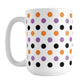 White mug with colorful polka dot pattern in orange, purple, and black, perfect for Halloween.
