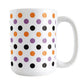 White mug with colorful polka dot pattern in orange, purple, and black, perfect for Halloween.