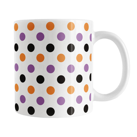 White mug with colorful polka dot pattern in orange, purple, and black, perfect for Halloween.