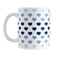 Hearts in Blue Mug (11oz) at Amy's Coffee Mugs. A ceramic coffee mug designed with hearts in different shades of blue, with the darker navy blue color across the middle and the lighter blue along the top and bottom, in a pattern that wraps around the mug to the handle.