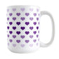 Hearts in Purple Mug (15oz) at Amy's Coffee Mugs. A ceramic coffee mug designed with hearts in different shades of purple, with the darker purple color across the middle and the lighter purple along the top and bottom, in a pattern that wraps around the mug to the handle.