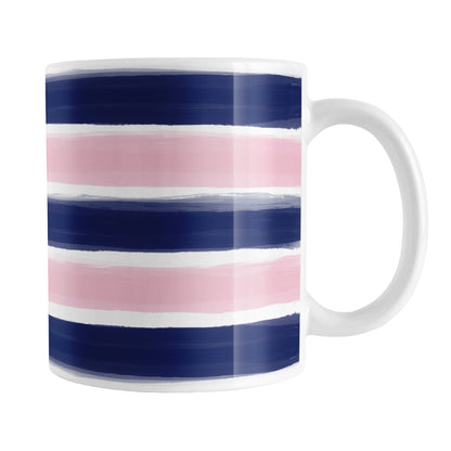 Navy Pink Paint Brush Strokes Mug (11oz) at Amy's Coffee Mugs. A ceramic coffee mug featuring a print of artistic paint brush strokes horizontally across the mug up to the handle, in alternating colors of navy blue and pink.