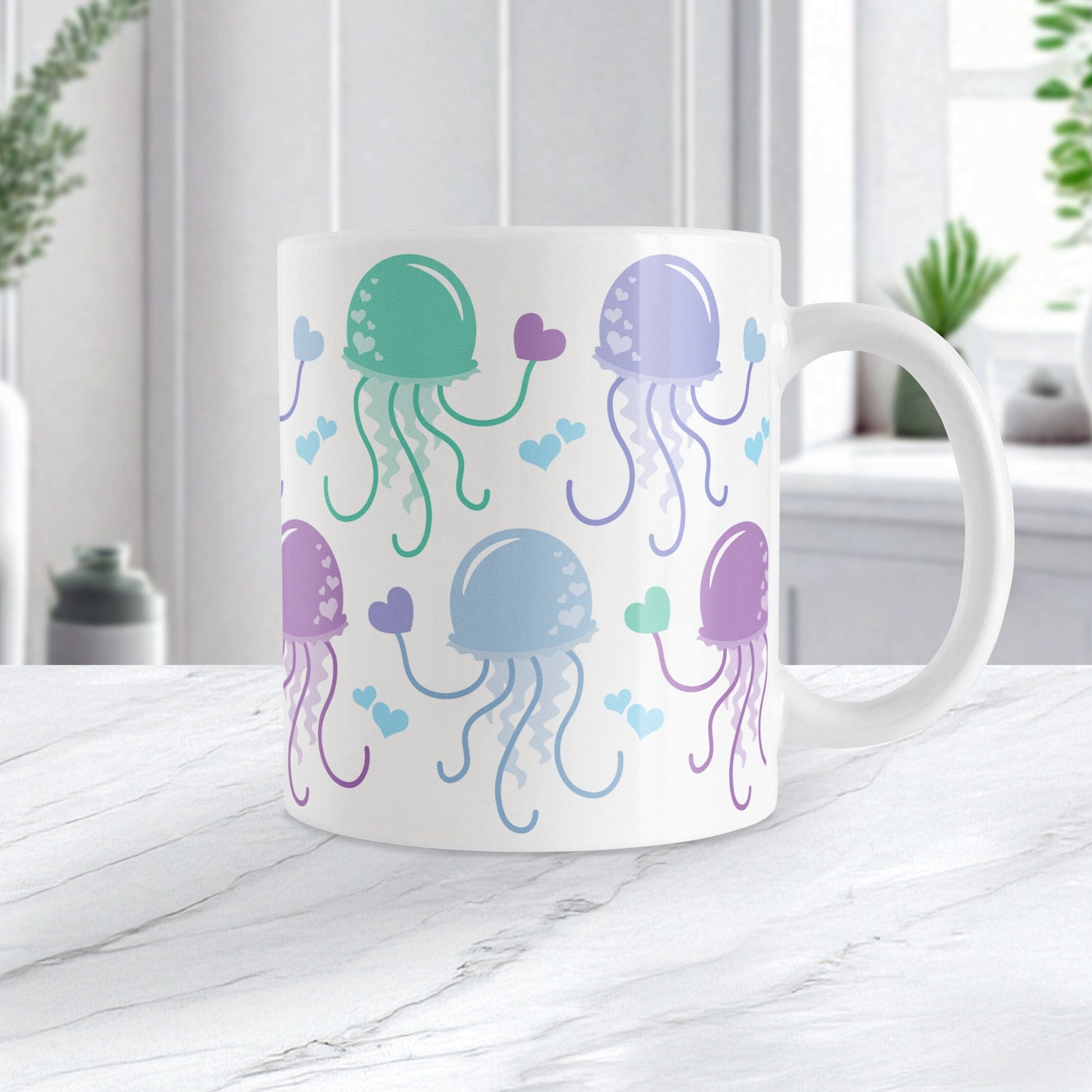 11oz white ceramic mug with a colorful, pastel jellyfish design, on a marble countertop