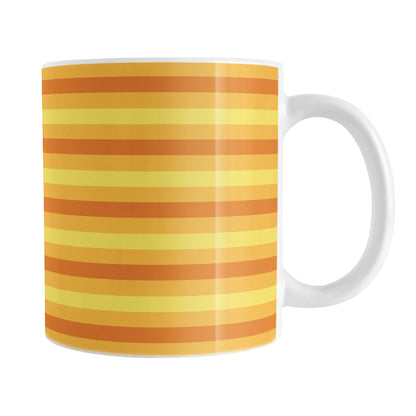 11oz white mug with orange and yellow striped pattern
