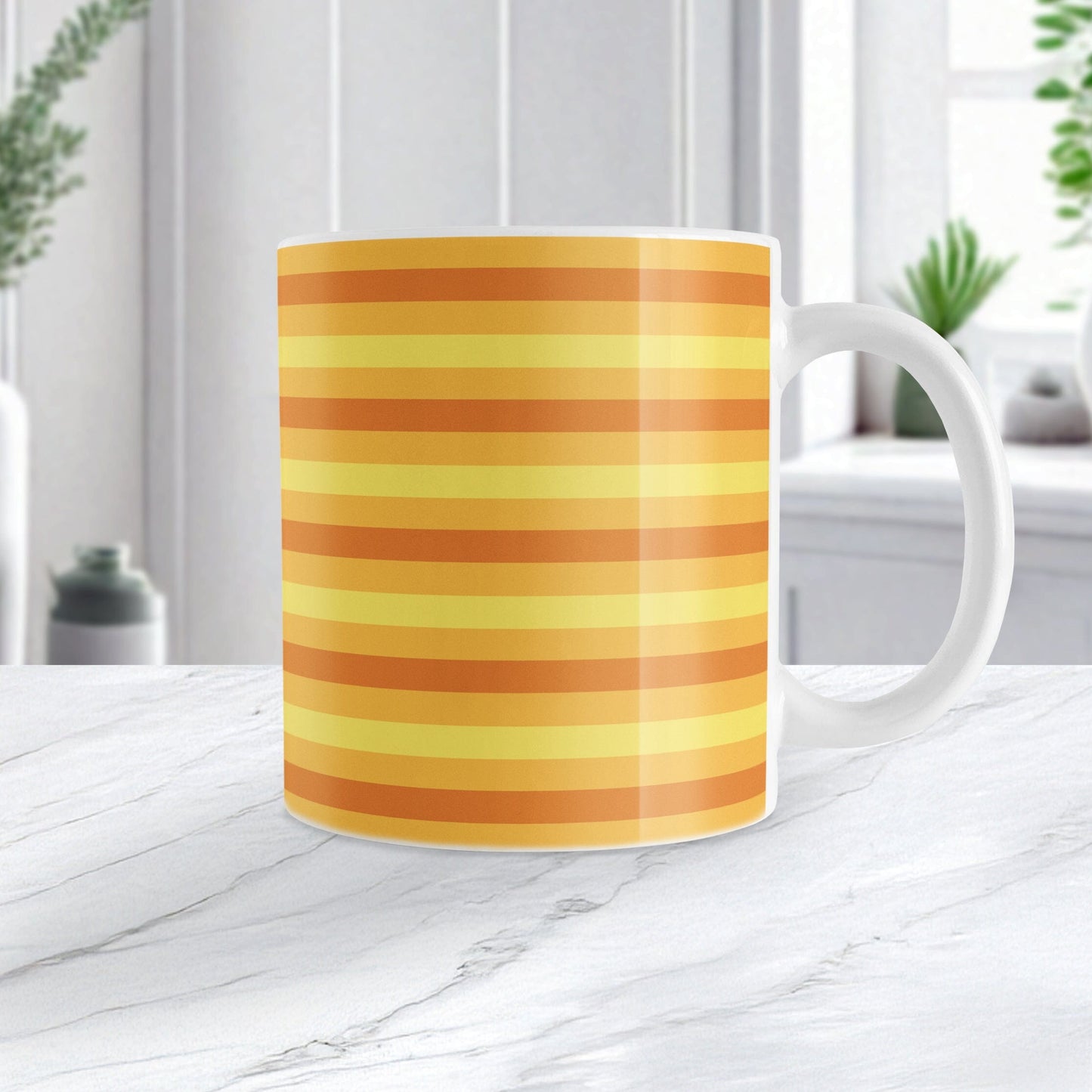 11oz white mug with orange and yellow striped pattern, sitting on a marble countertop