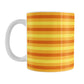 11oz white mug with orange and yellow striped pattern