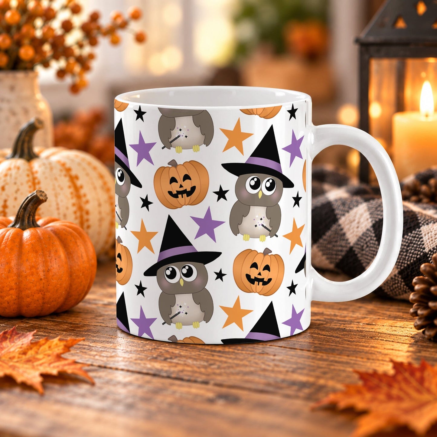 11 oz white ceramic mug for Halloween with owls wearing a witch hat, smiling carved pumpkins, and orange, purple, and black stars, shown on a wooden table with fall decor. 