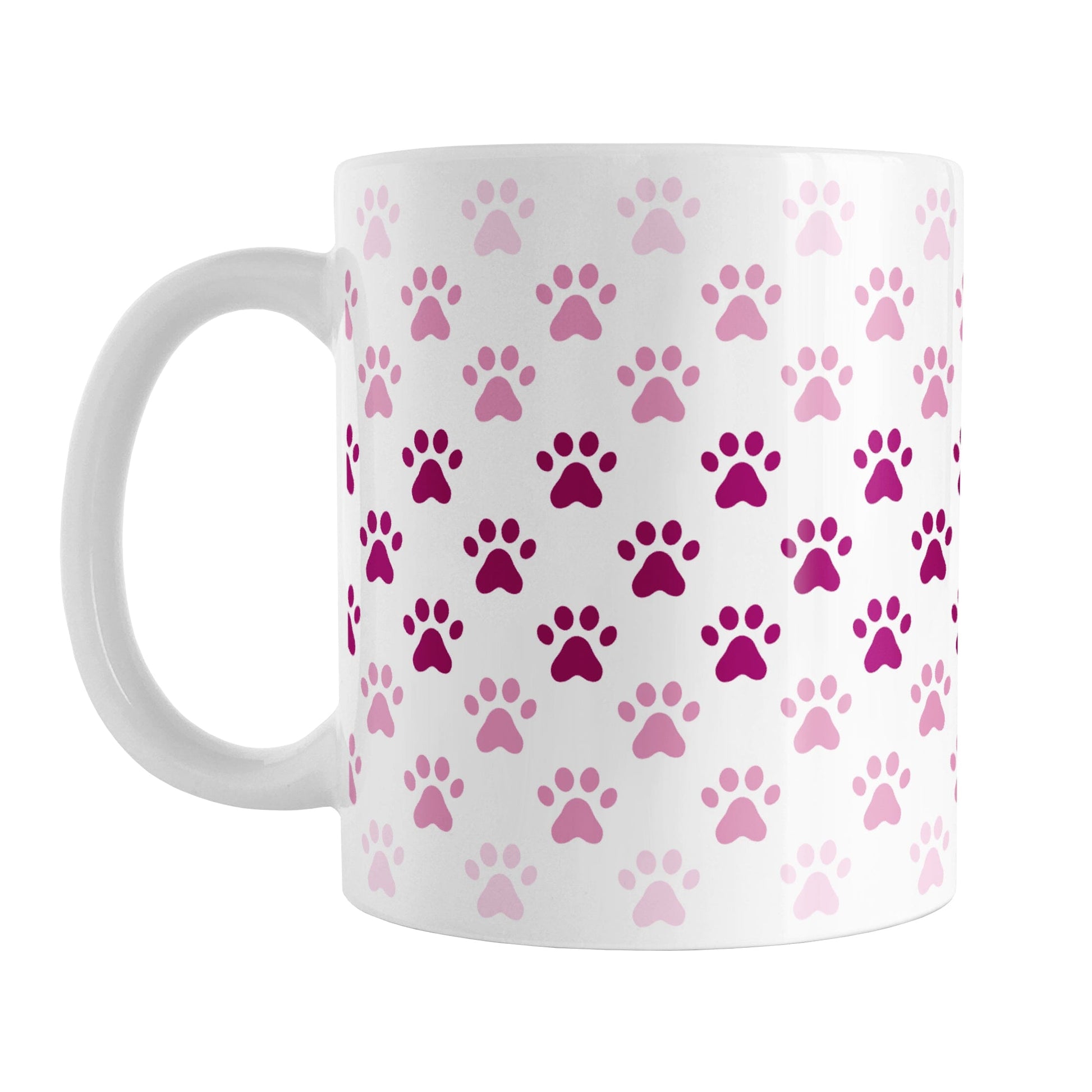 Paw Prints in Pink Mug (11oz) at Amy's Coffee Mugs. A ceramic coffee mug designed with paw prints in different shades of pink, with the darker pink color across the middle and the lighter pink along the top and bottom, in a pattern that wraps around the mug to the handle.