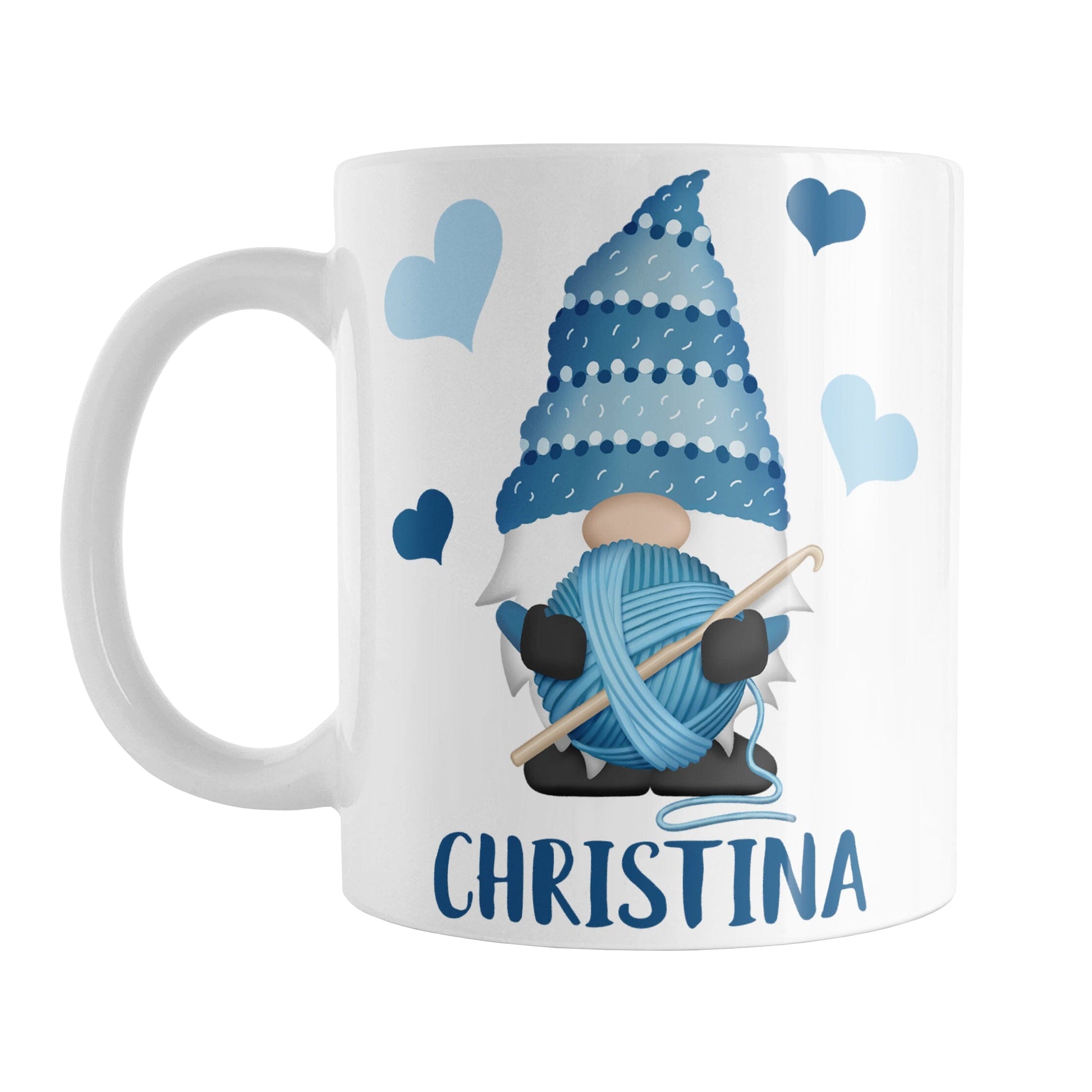 Personalized Blue Crochet Gnome Mug (11oz) at Amy's Coffee Mugs. A ceramic coffee mug designed with a cute gnome wearing a blue crochet hat while holding a ball of blue yarn and a crochet hook with blue hearts around him. Your name is printed in a fun blue font below the gnome. This adorable illustration and personalization is on both sides of the mug. 
